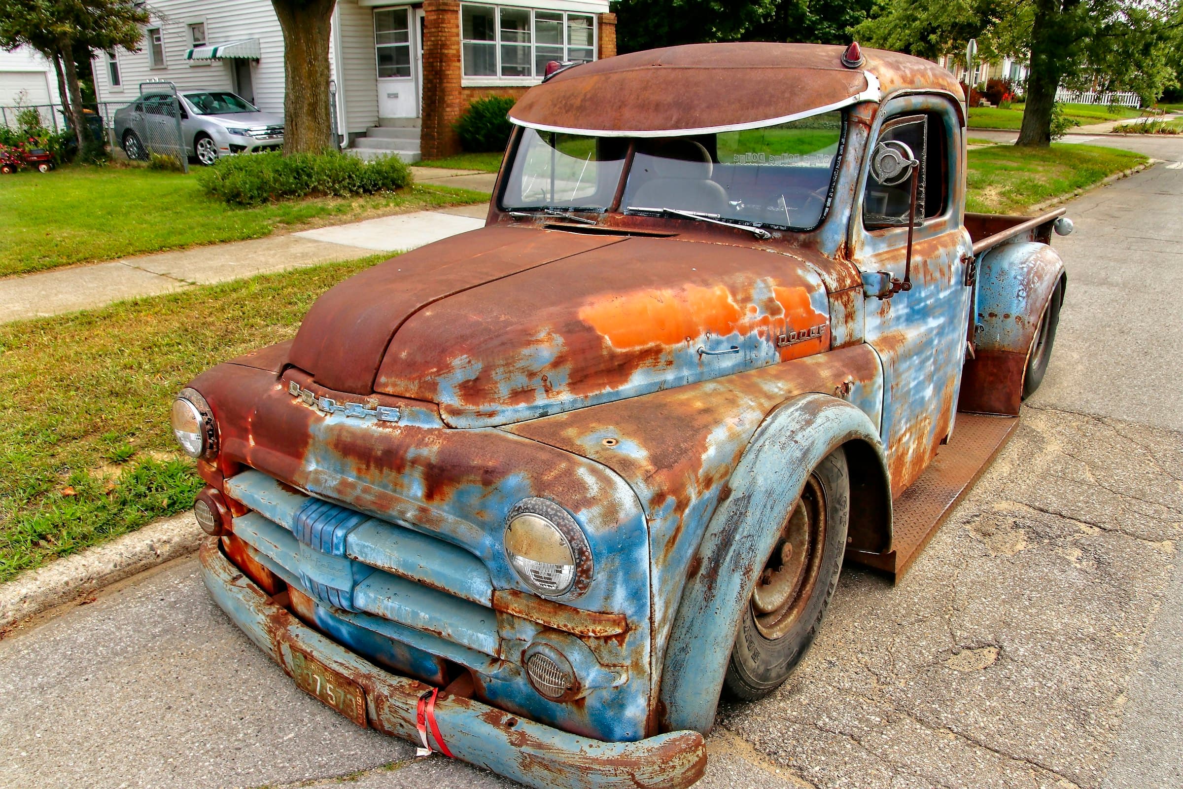 The first Copperline truck — a 1950s Dodge pickup in rust and washed-blue patina